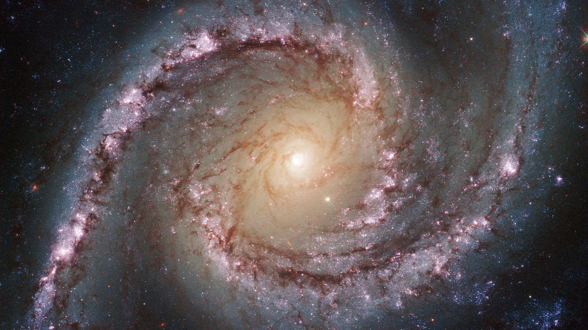 Photo Photo: An image of Hubble Undated NGC 1566, a galaxy located about 40 million light years in the constellation Dorado (the Dolphinfish).